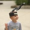 An audience member wears handmade antennas, part of the interactive performance and activity